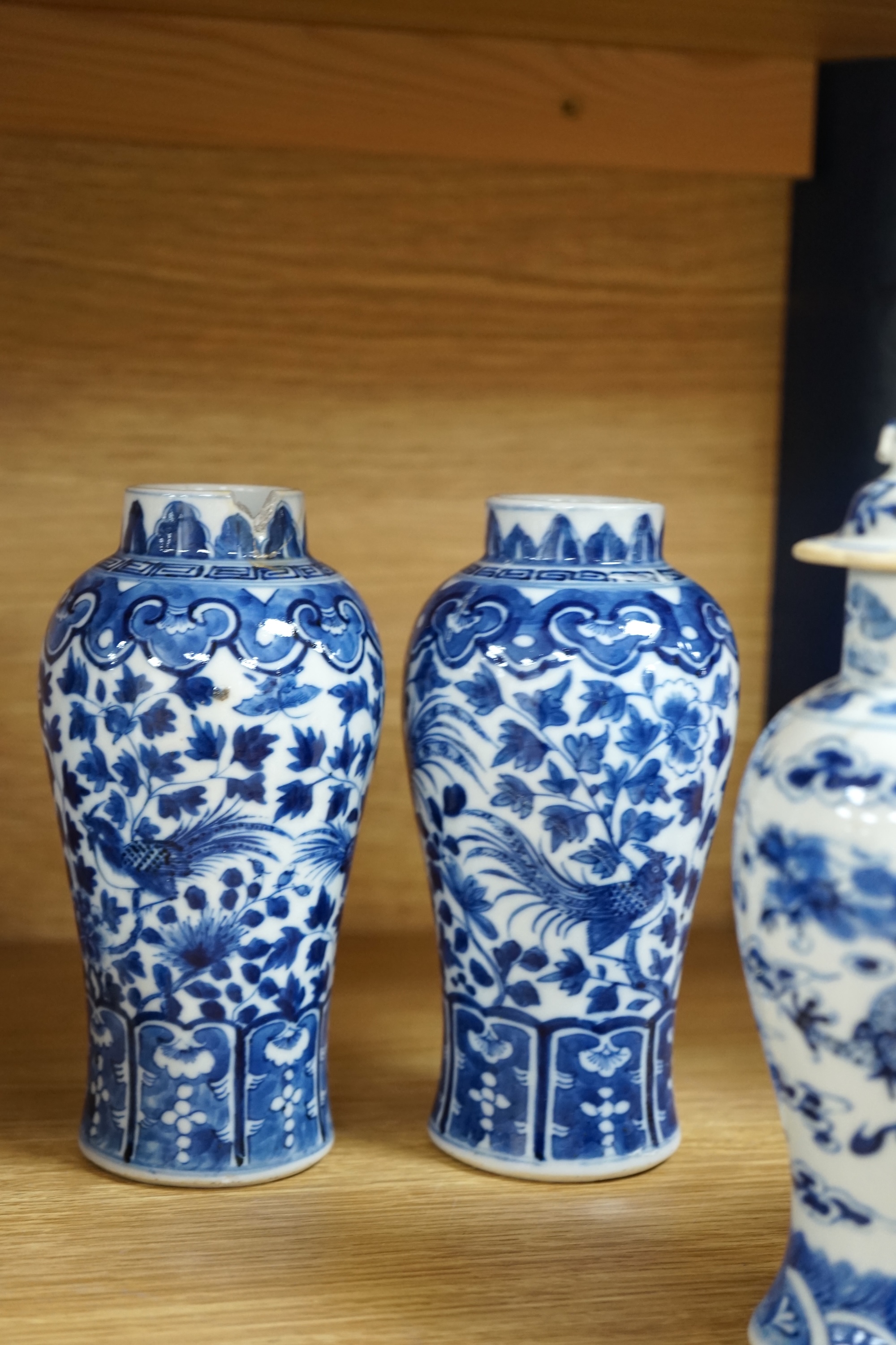 A collection of 19th and 20th century Chinese blue and white vases and tea bowls, largest 21cm high. Condition - varies, mostly poor